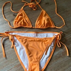 Victoria’s Secret String Bikini in Tangerine. Brand new, size Medium